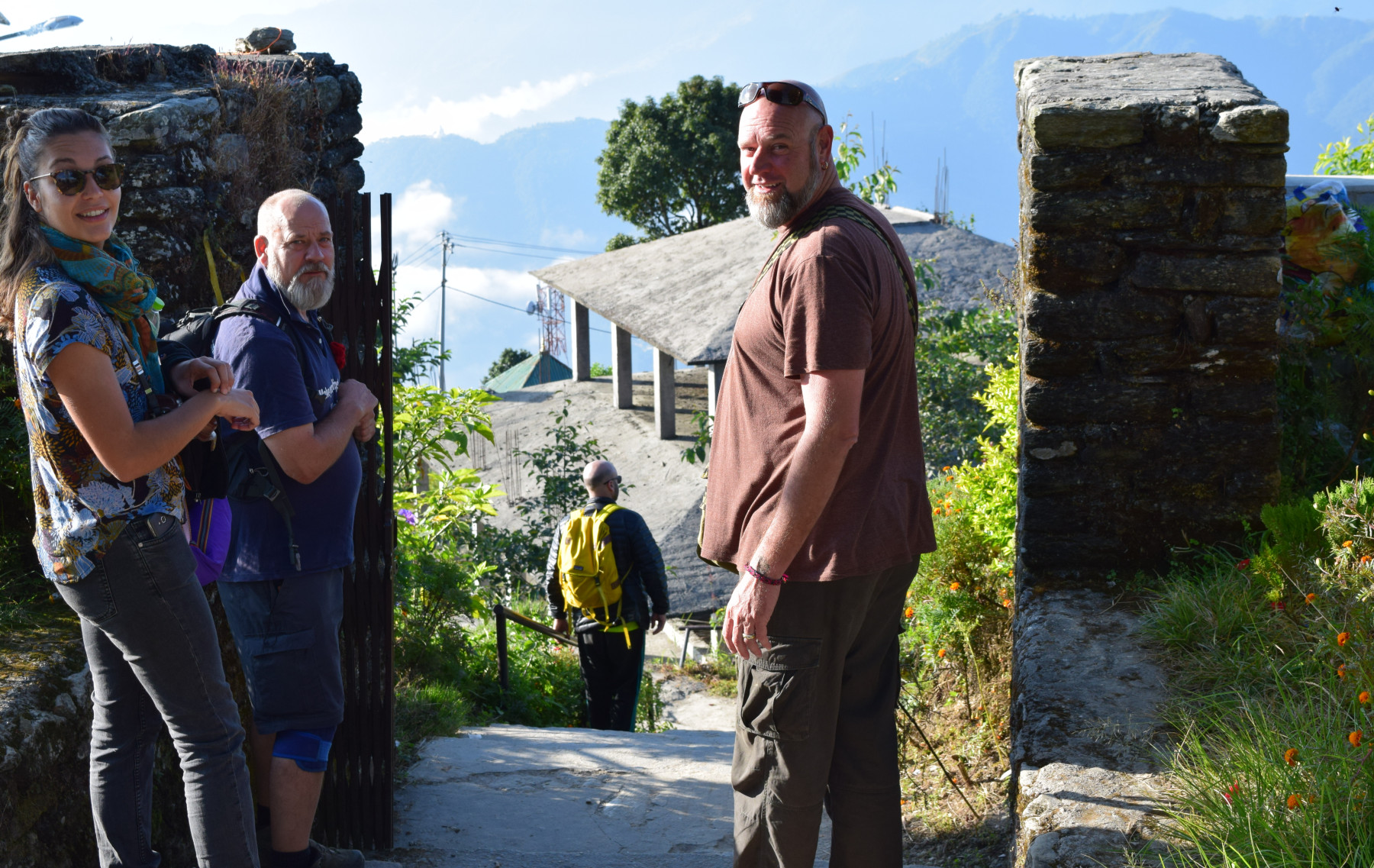 Four people waaiting to walk to mountains